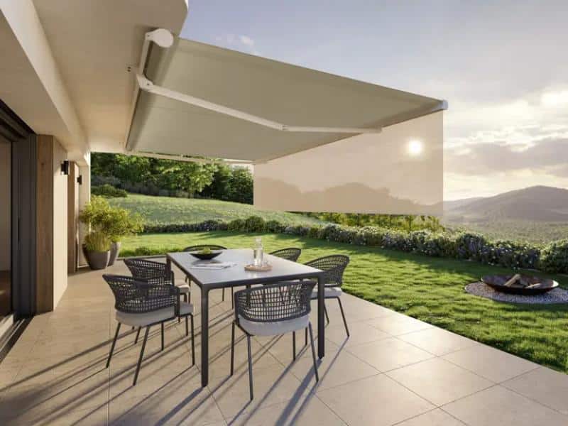 Retractable awning extended over patio at evening