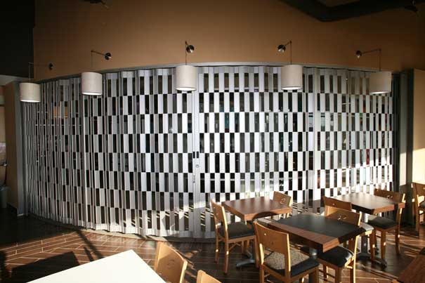Folding security grille in food court
