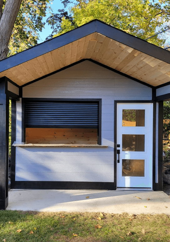 Black roller shutter on an outdoor cabana structure