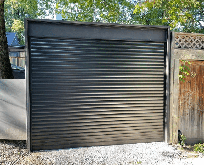 Black roll-up garage door on a downtown Toronto laneway house