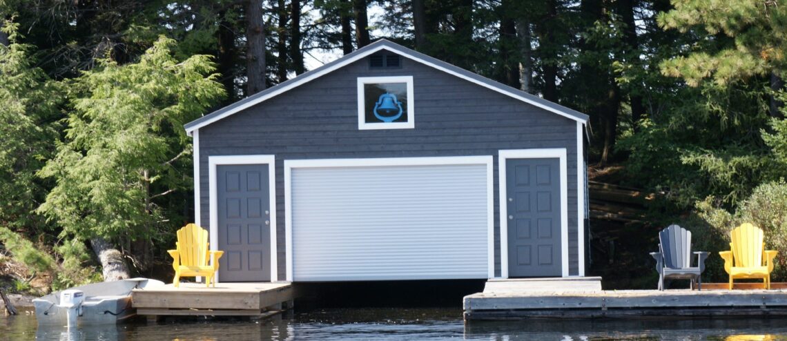 Boathouse with aluminum roll-up doors on Blue Bell Island