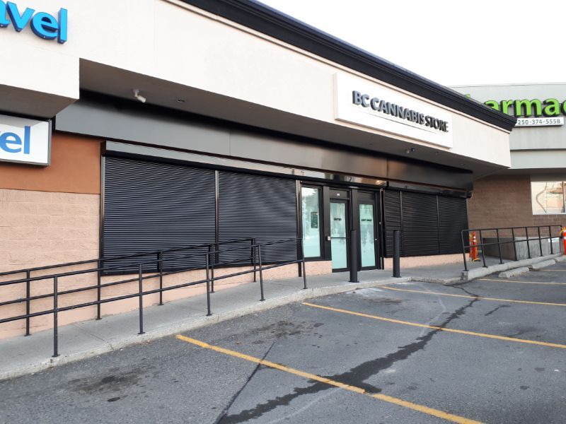 Cannabis dispensary storefront protected by a commercial roll-up shutter
