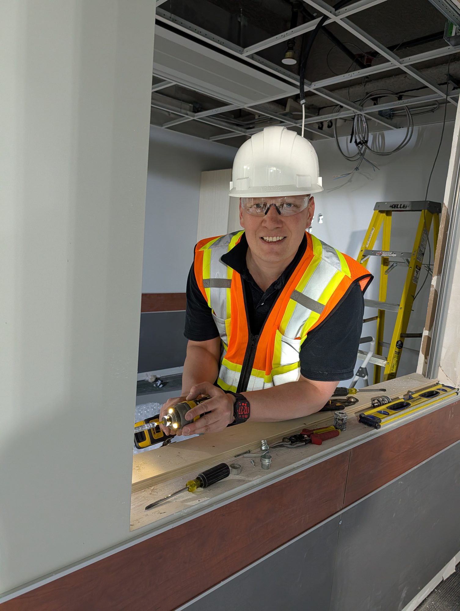 Installer fitting a counter shutter at a service opening