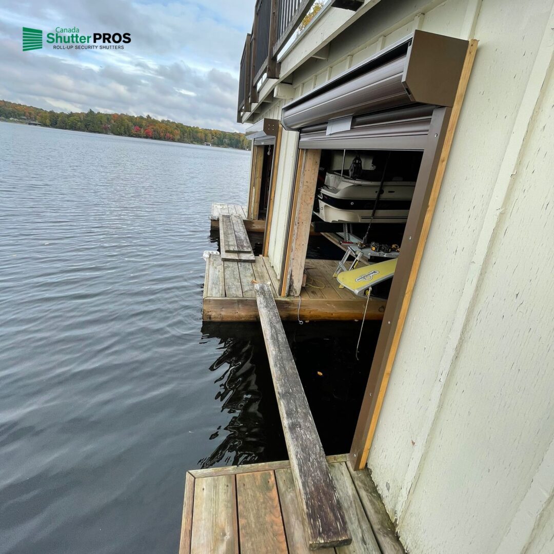 Waterfront lake house with a roll-up door on the lower level