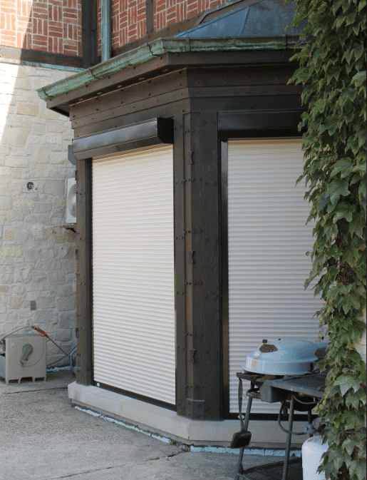 Roller shutters covering patio doors on a residential property