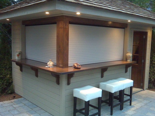 Wooden cabana with a roll-up shutter above the bar counter