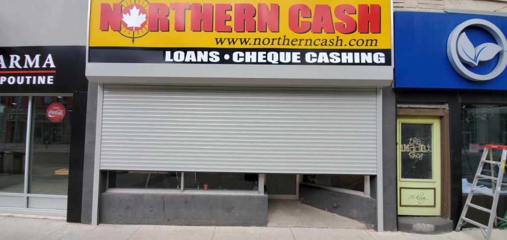 Roll-up security shutter lowered on a Cash Store retail location