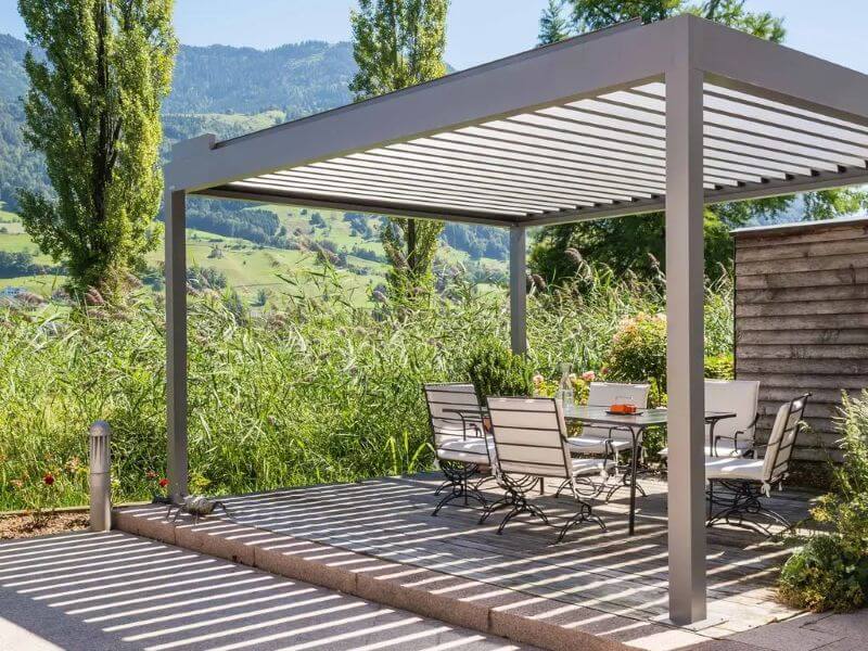 Aluminum pergola over garden patio area