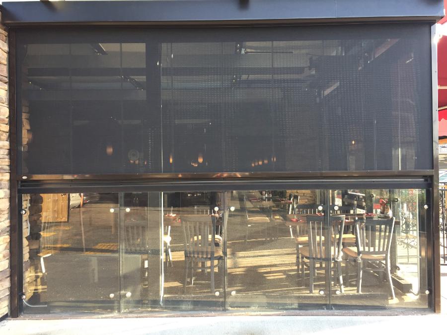 Retractable screen on restaurant patio