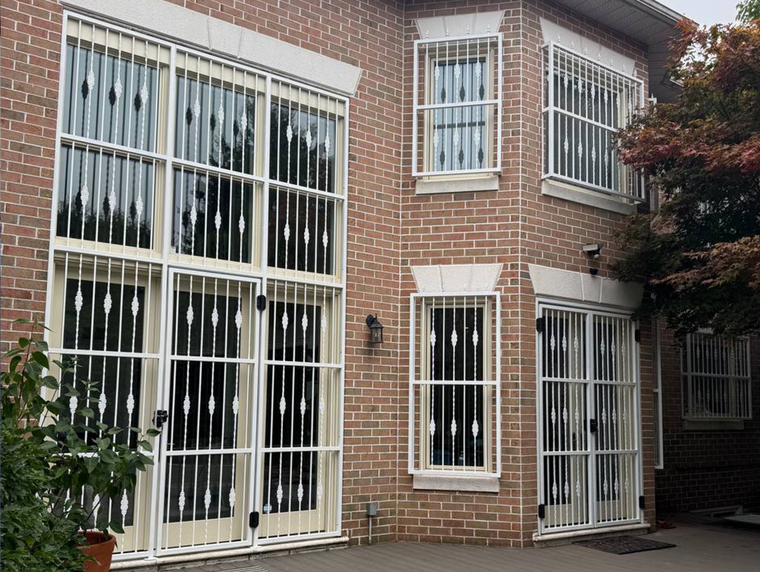 Fixed black security bars installed over a narrow exterior window